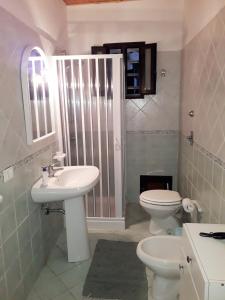 a bathroom with a sink and a toilet at Celebrity House in Marsala