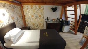 
Łóżko lub łóżka w pokoju w obiekcie Villa Genevra
