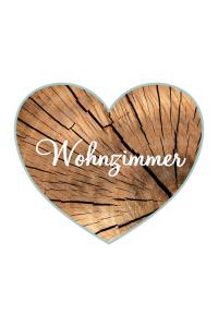 a wooden heart with the word winter written on it at Ferienwohnung HERZALLERLIEBST in Bad Lauterberg