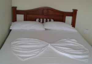 Cama o camas de una habitación en Cabañas en Coveñas frente a la playa