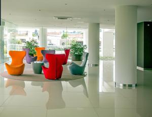 a group of colorful vases on a table in a room at ONIX BY GM RENTALS in Punta del Este