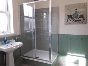 a bathroom with a shower and a sink at The Haven in Gateshead +79 photos
