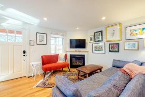 a living room with a couch and a fireplace at Summer Sun in Provincetown