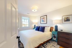 a bedroom with a bed and a blue dresser at Summer Sun in Provincetown