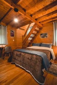 En eller flere senge i et værelse på Eco Pousada Invernador