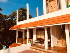Balkón nebo terasa v ubytování Lemon Dew Beach House, Alleppey Beach + 27 fotografií