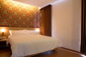 Cama o camas de una habitación en DeMira Hotel