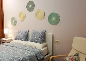 a bedroom with a bed and four mirrors on the wall at Casa Centro in Donostia-San Sebastián