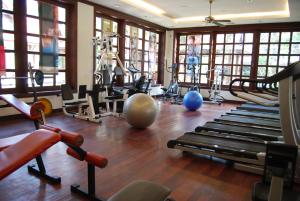 a gym with a bunch of machines and exercise balls at Borei Angkor Resort & Spa in Siem Reap