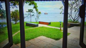 a view of the ocean from a porch at Punnamada Resort in Alleppey