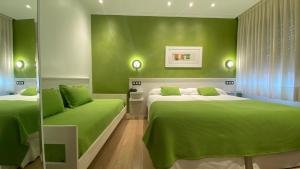 Cama o camas de una habitación en Hostal Paris