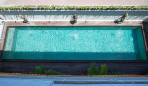 a large pool of water in a building at Matra Co Working & Co Living in Canggu