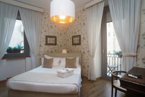 a bedroom with a bed with a box on it at Residenza Echia in Naples