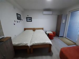Postelja oz. postelje v sobi nastanitve NULI apartments