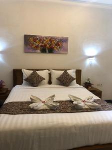 Cama o camas de una habitación en Jiva Bungalow