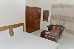 Ένα ή περισσότερα κρεβάτια σε δωμάτιο στο Hotel Water Orchid