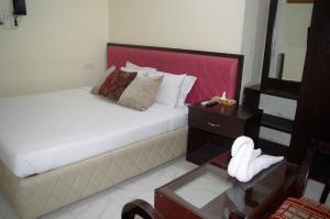 Ένα ή περισσότερα κρεβάτια σε δωμάτιο στο Hotel Water Orchid