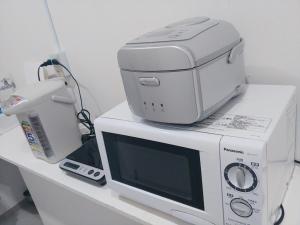 Köök või kööginurk majutusasutuses Simple Stay Miyajima