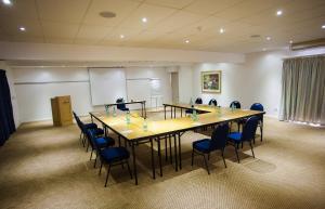a conference room with a long table and chairs at Arniston Spa Hotel in Arniston +68 photos