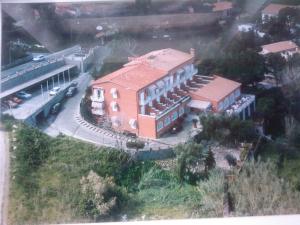 an aerial view of a building with a train station at Hotel Acquamarina in Portoferraio