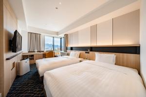 Keio Prelia Hotel Sapporo客房内的一张或多张床位