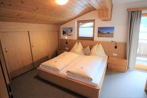 Llit o llits en una habitació de Haus Weitgasser