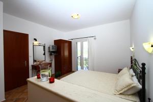 Postel nebo postele na pokoji v ubytování Villa Polyxeni Apartments