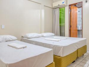 Ένα ή περισσότερα κρεβάτια σε δωμάτιο στο Pousada Ilha Costeira
