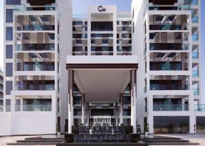 a view of a building with tall buildings at C Central Hotel and Resort The Palm in Dubai