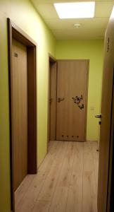 an empty room with a hallway with a door at Bridge Hotel in Rīga