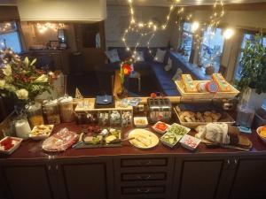 a counter with many food items on it at Botel Zwaantje in Amsterdam