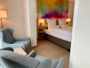 Ein Bett oder Betten in einem Zimmer der Unterkunft Thermalhotel Kemper