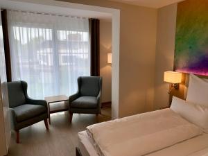 Ein Bett oder Betten in einem Zimmer der Unterkunft Thermalhotel Kemper