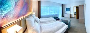 Ein Bett oder Betten in einem Zimmer der Unterkunft Thermalhotel Kemper
