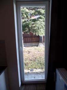 an open door with a view of a yard at Apartmány City in Ostrava