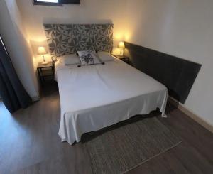 Postel nebo postele na pokoji v ubytování Domaine de la Testa
