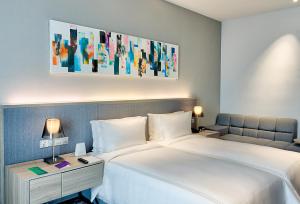 Posteľ alebo postele v izbe v ubytovaní Capri by Fraser Johor Bahru
