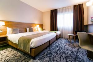 Katil atau katil-katil dalam bilik di Utopia Hotel - Art & Nature Hotel