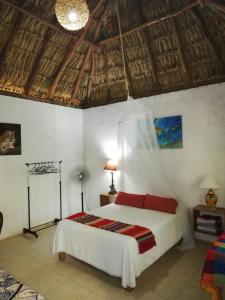 Posteľ alebo postele v izbe v ubytovaní Mayan Bungalow Near Chichén