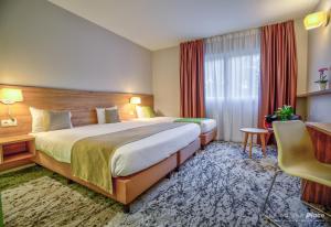 Katil atau katil-katil dalam bilik di Utopia Hotel - Art & Nature Hotel