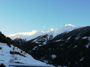 a view of a mountain range with snow covered mountains at Wurlerhof in Kals am Großglockner