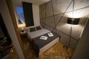 Voodi või voodid majutusasutuse Royal Apartment toas