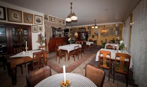 a restaurant with tables and chairs in a room at Motel Klara in Sobótka