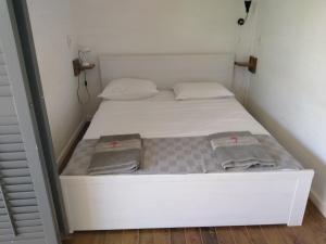 Postel nebo postele na pokoji v ubytování Red Palm Village