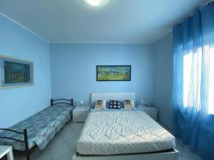 Postel nebo postele na pokoji v ubytování B&B Il Moai + 37 fotografií