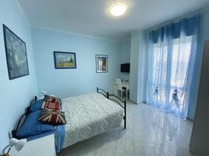 Postel nebo postele na pokoji v ubytování B&B Il Moai