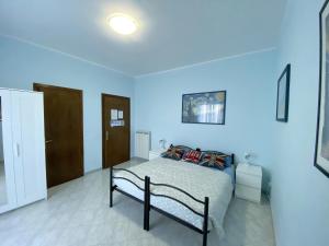Postel nebo postele na pokoji v ubytování B&B Il Moai