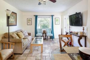 a living room with a couch and a table at Home by Beach 3 - Delnor-Wiggins in Naples