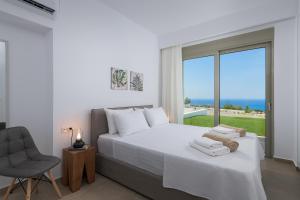 Posteľ alebo postele v izbe v ubytovaní Villa Dione in Pefkos, Lindos area