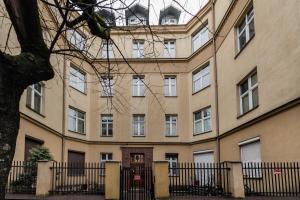 a large building with windows and a door at Hugo in Krakow